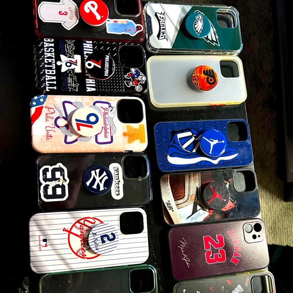 These cases fit iPhone 12 and have never been used except 1 of the 76ers cases